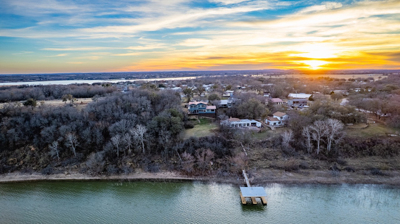 Aerial drone photography of lakefront property at sunset, Central Texas